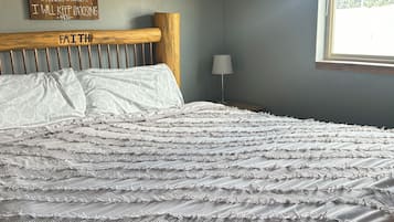 1 habitación, tabla de planchar con plancha y cuna de viaje