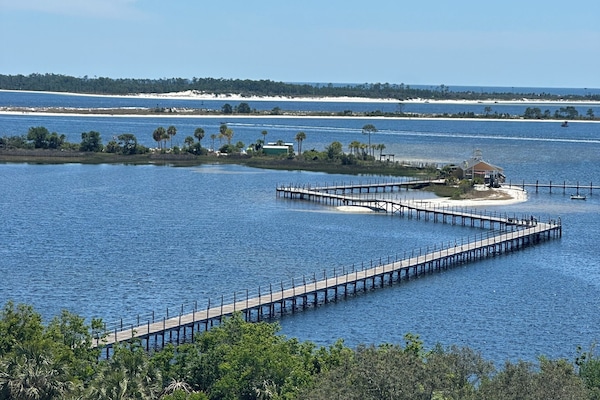 Walk the Pier to Pelican's Bar or the private beach.