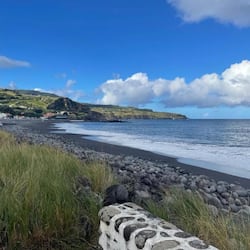 On the beach, black sand