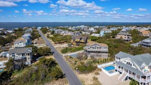 A coastal residential area with houses, a road, and a swimming pool. - OceanSound - 500 Feet to the Ocean in Duck, NC! (Kitty Hawk)