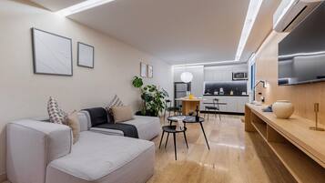 Superior Apartment, Balcony, City View | Living area | 40-inch flat-screen TV with cable channels