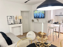 Apartamento | Zona de estar | Una Smart TV, una chimenea, Netflix, películas de pago