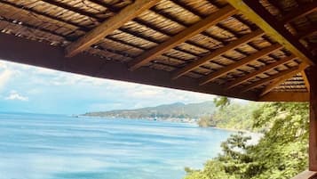 Comfort Room, Private Bathroom, Ocean View | 1 bedroom, bed sheets