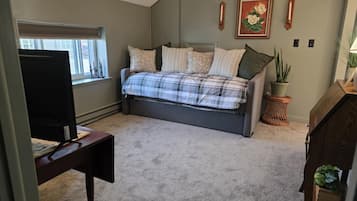 1 bedroom, desk, iron/ironing board, travel crib