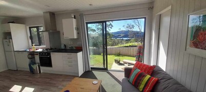 Itzy Bitzy house is colourful, cosy, fully fenced with sea views