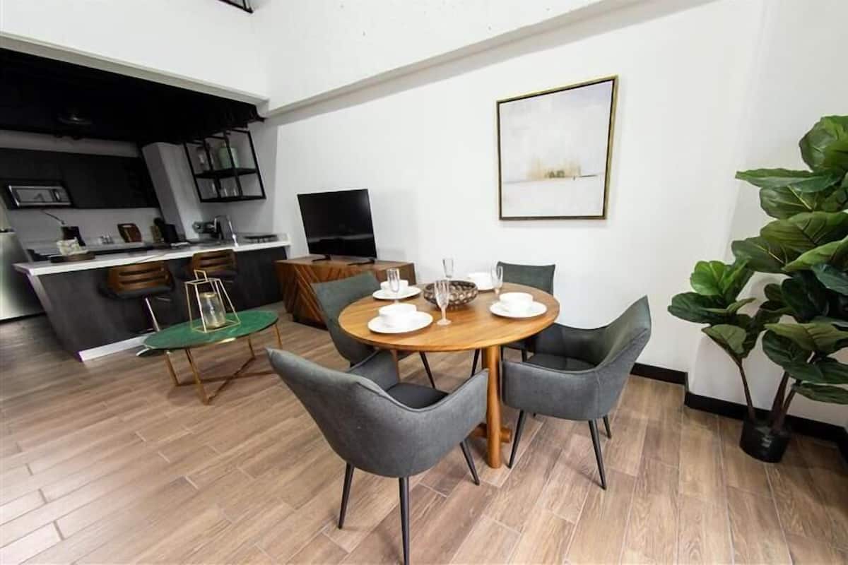 Loft (E1 Quintuple) | Living area | 50-inch LED TV with digital channels, Netflix, streaming services