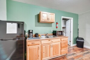 Fridge, microwave, coffee/tea maker, cookware/dishes/utensils