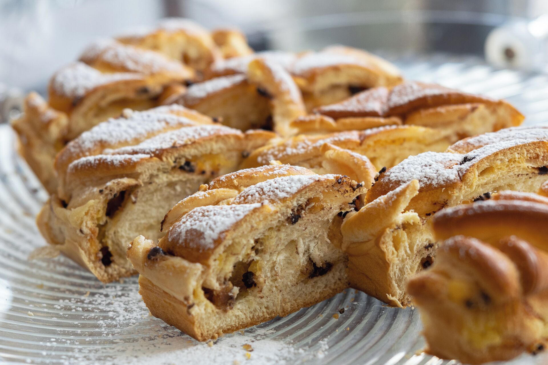 A loaf of bread with raisins on a plate.
