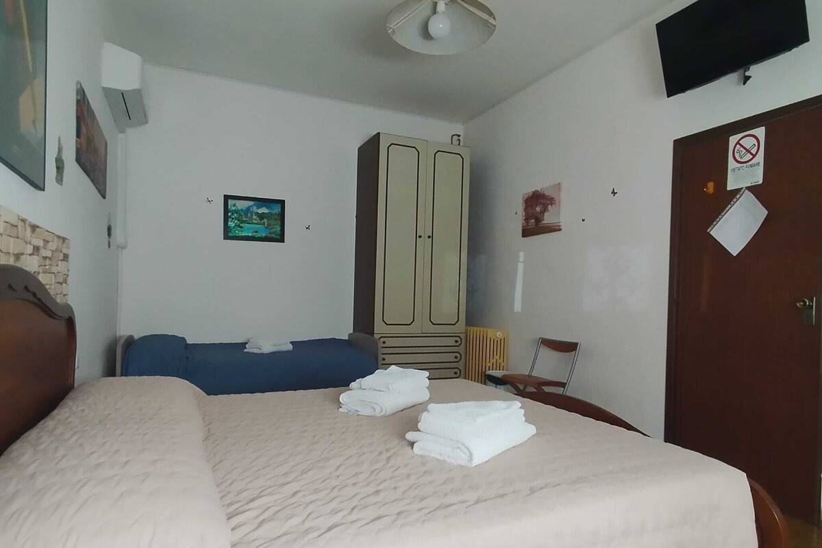 Family Room | Premium bedding, down comforters, memory foam beds, desk