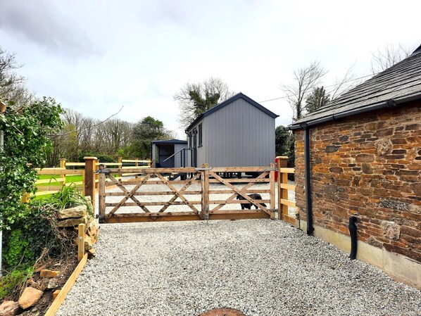 Stables and outbuildings surround this serene countryside setting.