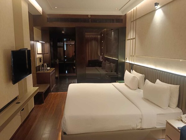 Deluxe Room | Egyptian cotton sheets, premium bedding, memory foam beds, in-room safe - The Galgotias Hotel (Gurugram)