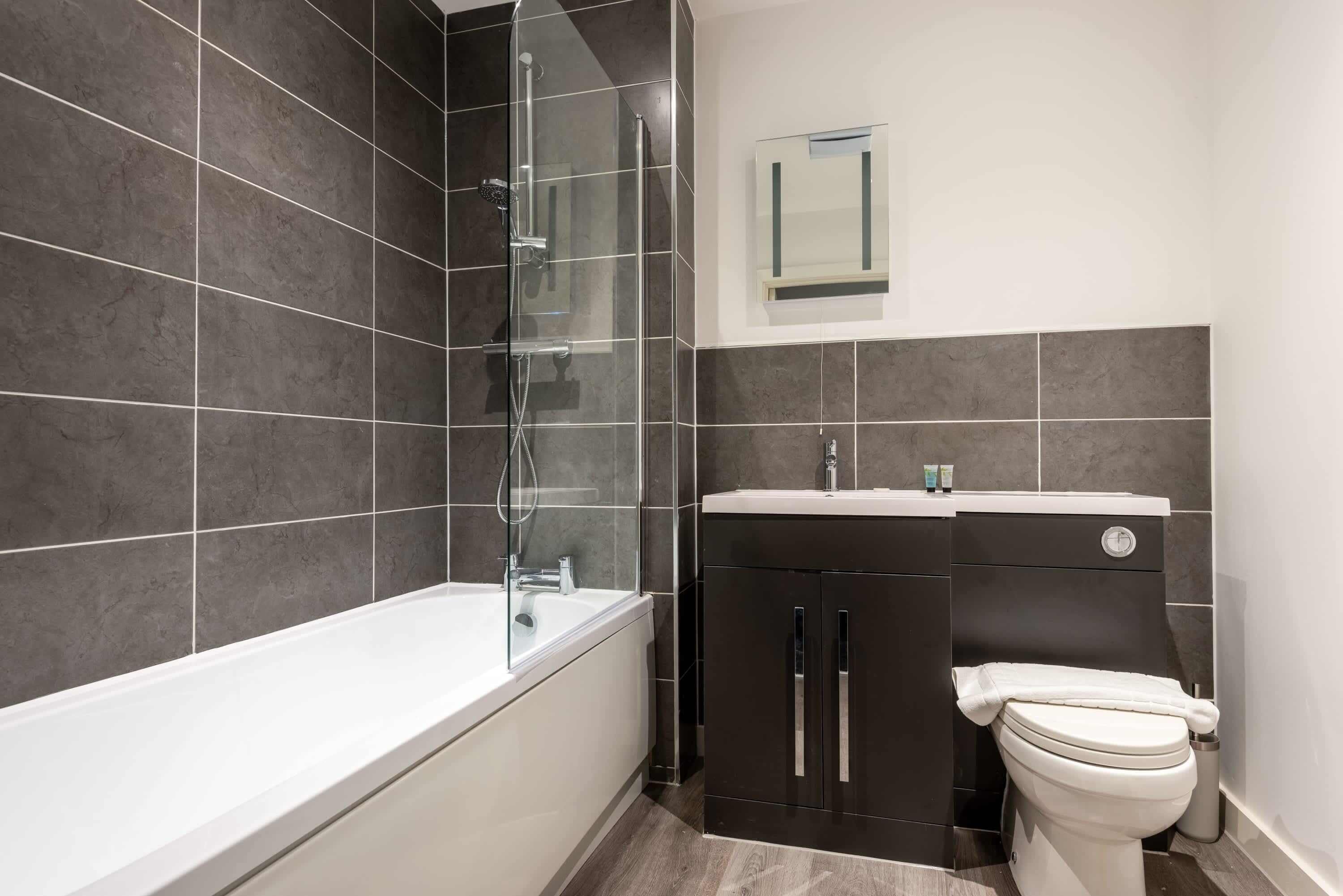 Shower, hair dryer, towels, shampoo