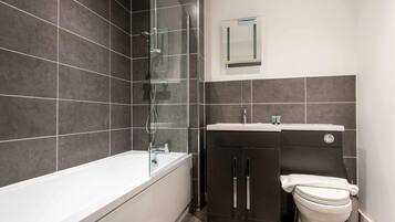 Shower, hair dryer, towels, shampoo