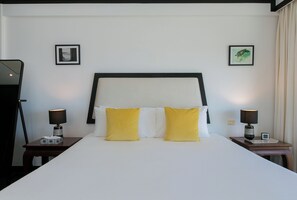 A hotel room with a large bed, two nightstands, a headboard, and two framed pictures on the walls. - Katamanda Villa Jade A6 Seaview Kata Beach (Muang Phuket)