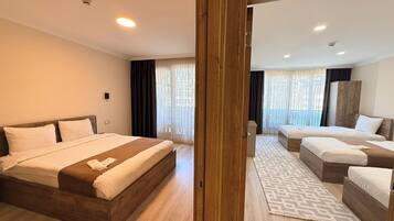 Deluxe Apartment, Balcony | Living area