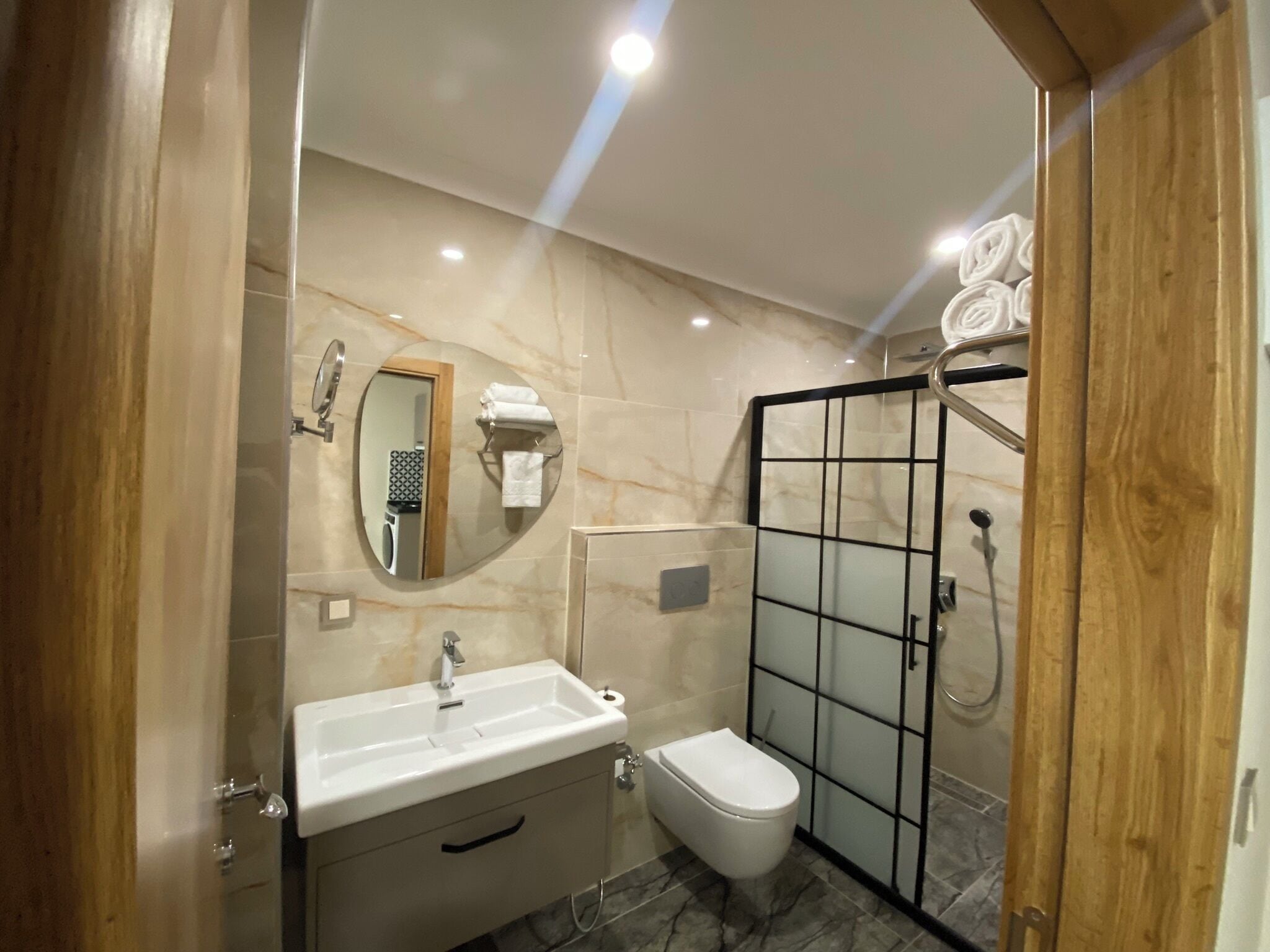 Deluxe Suite, Balcony | Bathroom | Shower, rainfall showerhead, hair dryer, bathrobes