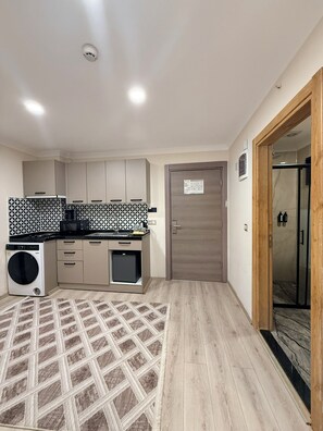 Deluxe Apartment, Balcony | Private kitchen | Mini-fridge, stovetop, espresso maker, coffee/tea maker