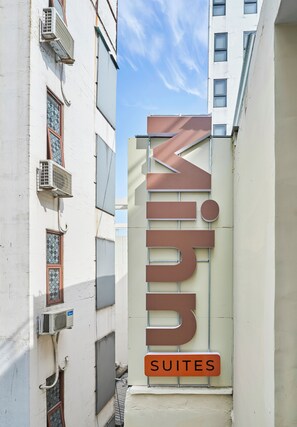 A building with a sign reading "Mihn Suites" indicating a hotel or lodging establishment. - Mihn Suites Ben Thanh (Ho Chi Minh City)