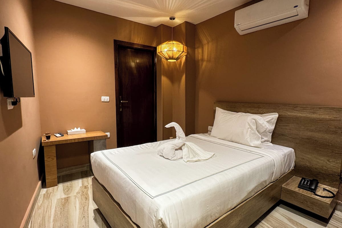 Standard Double Room, City View | Minibar, desk, soundproofing, iron/ironing board