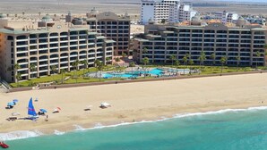 A resort with multiple hotel buildings, a beach, and a swimming pool. - Penthouse Beachfront at Sonoran Spa (Puerto Peñasco)