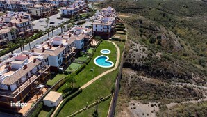 A residential area with modern apartment buildings, a well-maintained lawn, and two circular swimming pools. - Pleasant apartment with great views JUL01 (Ayamonte)