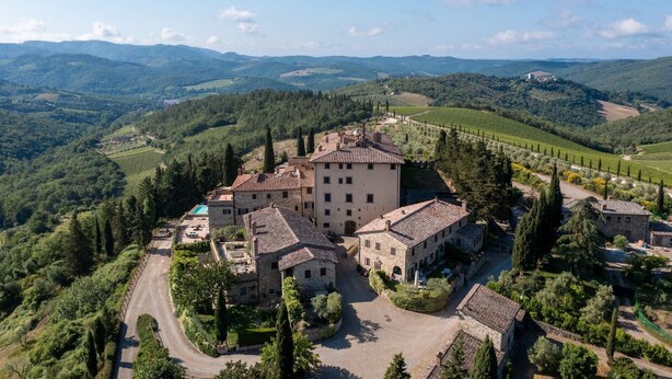 A historic stone building with multiple rooms, surrounded by lush vineyards and rolling hills. - Casa Luce, San Donato in Perano, Gaiole in Chianti, Siena and Chianti (Gaiole in Chianti)