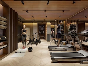 A modern gym with treadmills, exercise bikes, and a variety of fitness equipment. - Mövenpick Grand Hotel Wroclaw (Wroclaw)