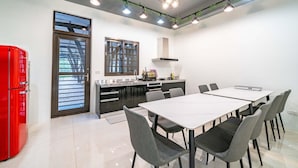 A modern kitchen with a dining area. - Young Villa (Wujie)