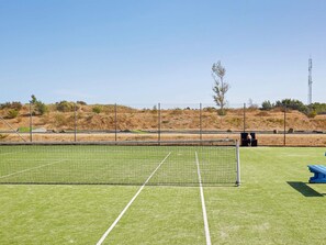 A sports field with a netted goal area, surrounded by a fence and a clear sky. - 4 Star Holiday Home in Ebeltoft (Ebeltoft)