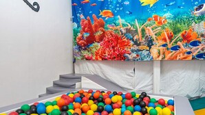 A colorful ball pit with a mural of an underwater scene in the background. - 8 Person Holiday Home in Henne (Henne)