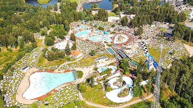 An aerial view of a theme park with multiple water attractions, a large pool, and a roller coaster. - 4 Person Holiday Home in Axvall-by Traum (Axvall)