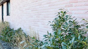 A brick building with a window and a door. - 5 Star Holiday Home in Forslov (Förslöv)
