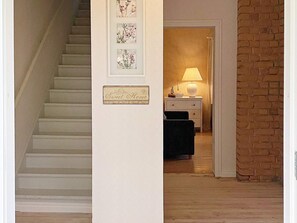 A staircase leading to a bedroom with a nightstand, a lamp, and a framed sign. - 4 Star Holiday Home in Vastra Amtervik (Vastra Amtervik)