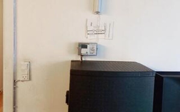 A room with a black cabinet, a wall socket, and a power outlet. - 6 Person Holiday Home in Skaerbaek-by Traum (Skaerbaek)