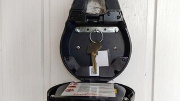A parking meter with a key inserted. - 6 Person Holiday Home in Albaek (Aalbaek)