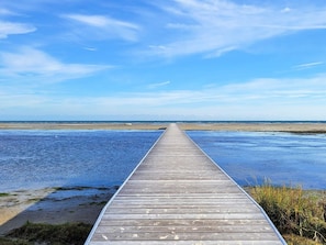 A wooden pier extending into a body of water with a clear sky above. - 6 Person Holiday Home in Hadsund (Hadsund)
