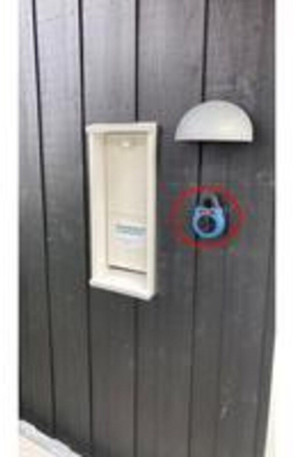A door with a mailbox and a mailbox cover. - 8 Person Holiday Home in Bogense (Bogense)