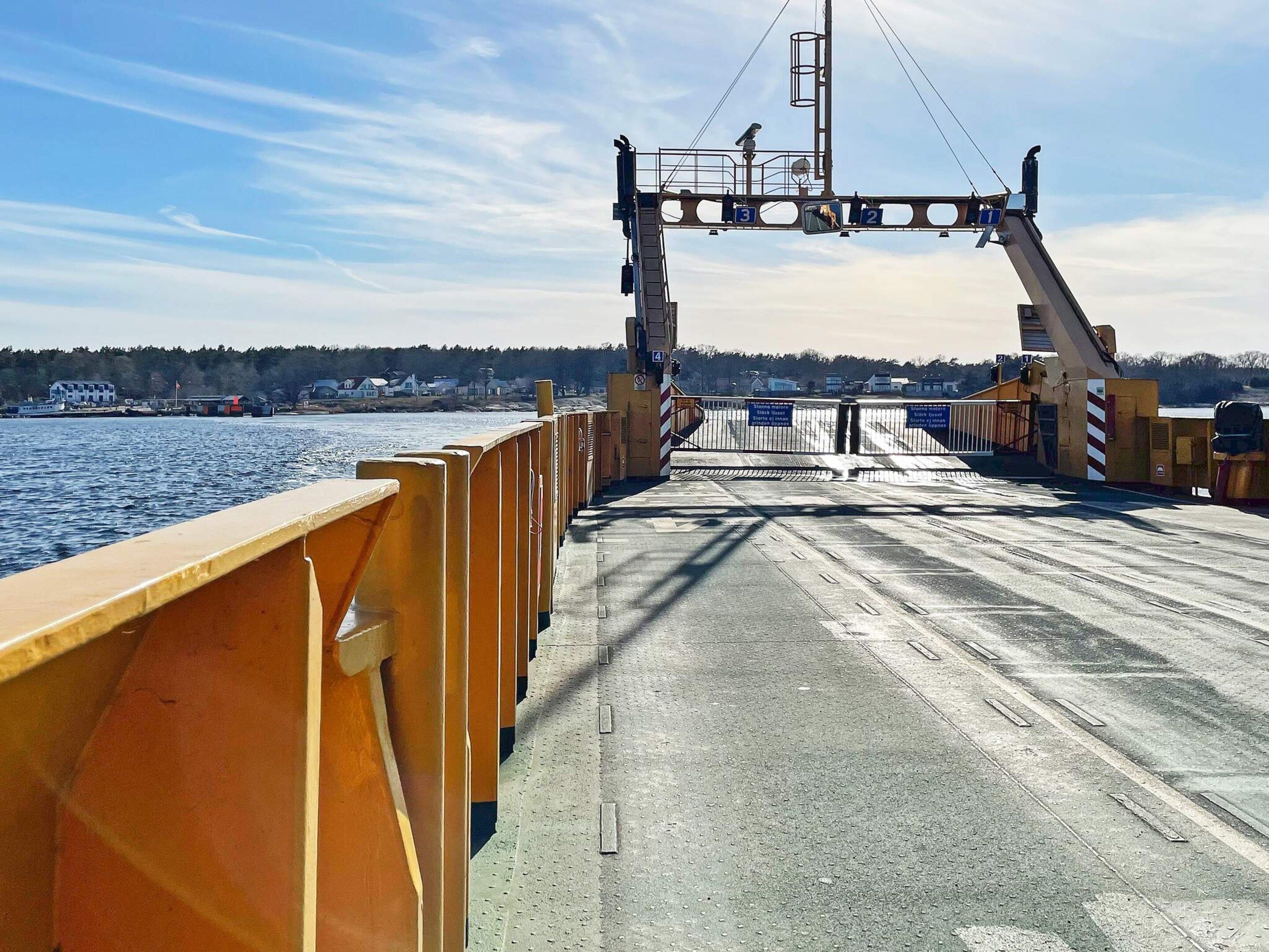 A bridge with a metal railing and a pedestrian walkway.