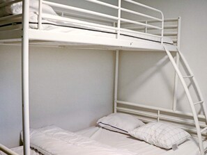 A bunk bed with white bedding and a ladder. - 4 Star Holiday Home in Ullared (Ullared)