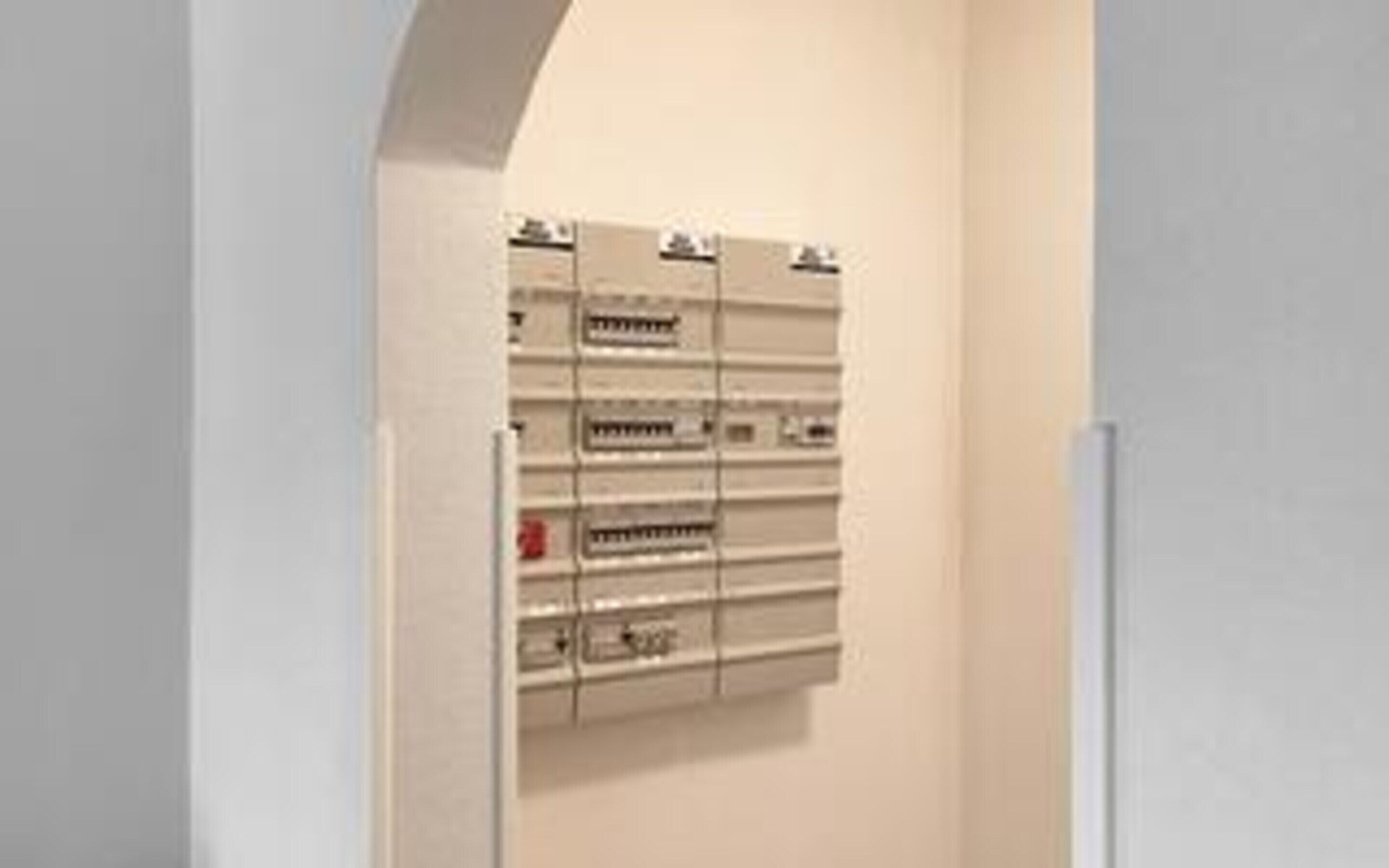 A wall-mounted electrical panel with multiple switches and indicators.