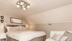 A bedroom with a large bed, a bedside table, a chair, and a ceiling light fixture. - 10 Person Holiday Home in Albaek (Aalbaek)