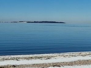 A calm sea with a distant island. - 4 Star Holiday Home in Logstor (Logstor)
