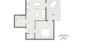 Un plan d’étage d’une chambre d’hôtel comprenant une cuisine, une terrasse et une salle de bain.