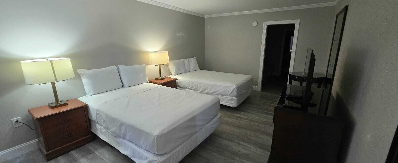 Room (2 Queen Bed & 1 Full Bed) | Desk, iron/ironing board, free WiFi, bed sheets