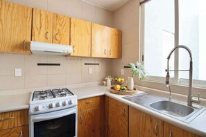 Fridge, microwave, stovetop, coffee/tea maker