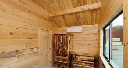 Tiny home, 2 bed, 1 bath, a loft area with 2 twin beds. located in a campground