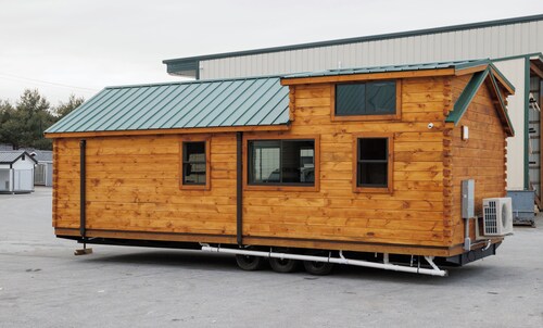 Tiny home, 2 bed, 1 bath, a loft area with 2 twin beds. located in a campground