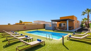 A rooftop pool area with lounge chairs and a small covered seating area. - Villa Humaik by Villa Plus (Antigua)