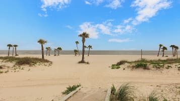 On the beach, sun loungers, beach towels