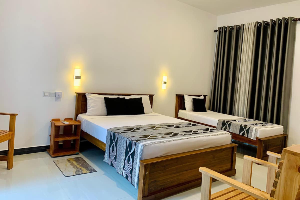 Deluxe Triple Room | Bed sheets
